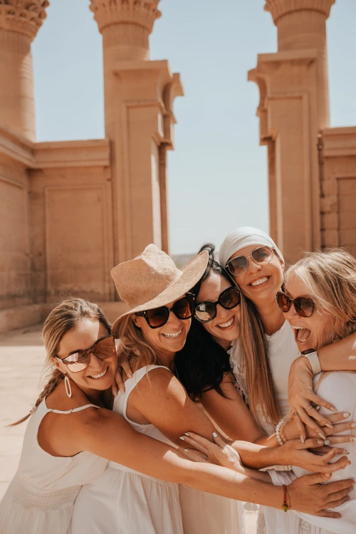 Women embracing at temple ceremony