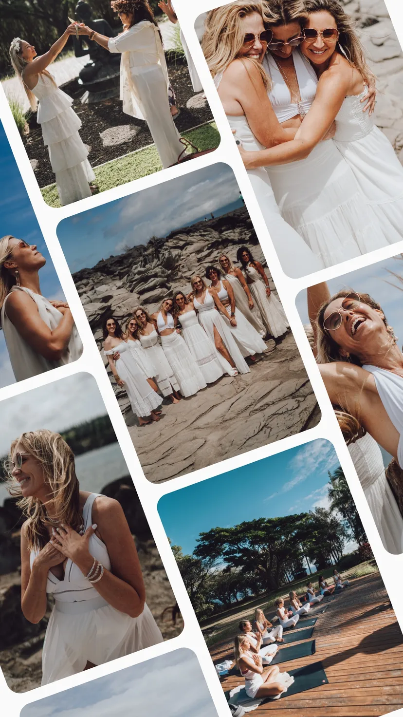 Women in white embracing in a group hug