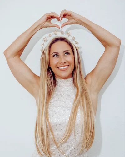 Vanessa Lambert making a heart shape with her hands